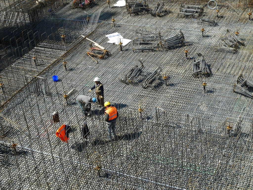 Aerial view of builders working on a construction site