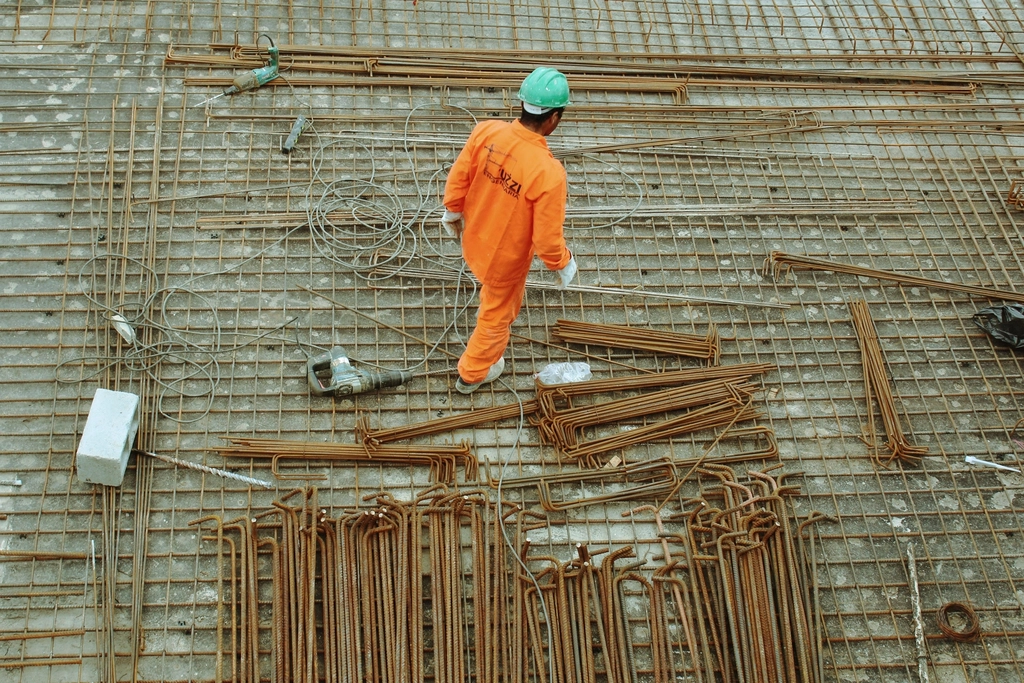 Construction worker on reinforcing steel at a building site